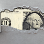 Dollar Bill behind ripped paper